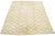 A stunning contemporary Moroccan-style wool rug, meticulously hand-knotted with a beige base and complemented by brown...