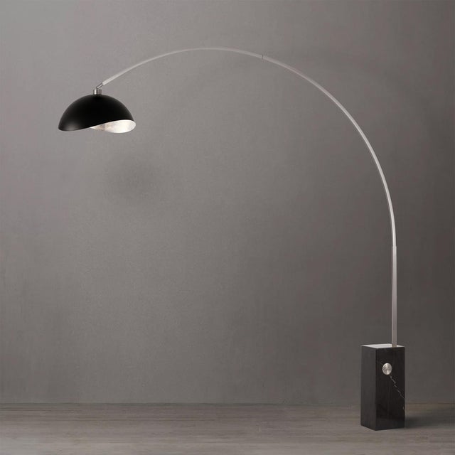 The Iconic Arc Lamp is a mid-century modern lighting masterpiece, featuring a satin nickel steel body and a striking black...