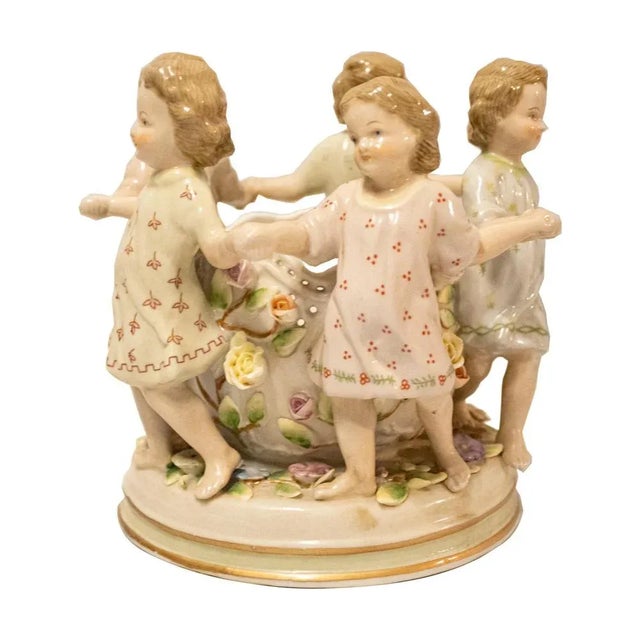 Sculptural set of children 5 children playing made of enamelled Meissen porcelain. Germany, first third of the 20th century.