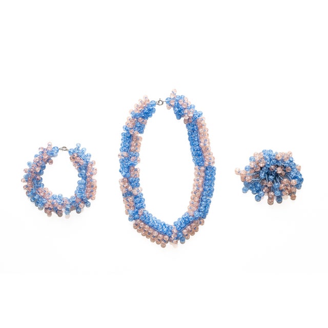 This beautiful set of 3 pieces of jewelry are Murano glass beads strung together. The set is a necklace, brooch and...