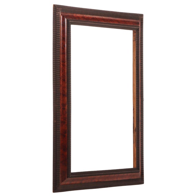 A sophisticated pair of Italian ebonized wood frames in the Dutch style, C. 1940, each distinguished by faux tortoise...