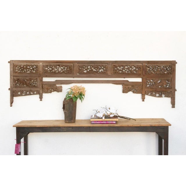 Imagine a time long past, perhaps in a sun-drenched courtyard of a grand noble's house in Java, or adorning the tranquil...