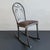 Vintage early 20th century, art deco rocking chair by The Doehler Metal Furniture Co. features a pressed, brushed steel...