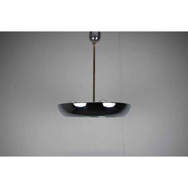 An original vintage UFO pendant lamp designed by Josef Hurka for Napako, Czechoslovakia, dating from the 1930s. This...