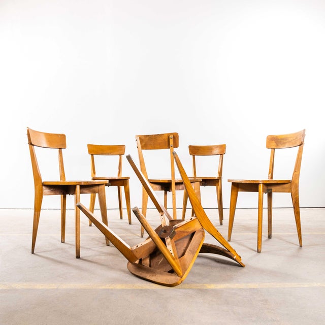 : 1950’s French Luterma Cross Base Bentwood Dining Chairs - Set Of Four The process of steam bending beech to create...