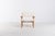Vintage chair designed by Hans. J. Wegner for Getama. The seat and backrest is upholstered in sheep fur with a frame in...
