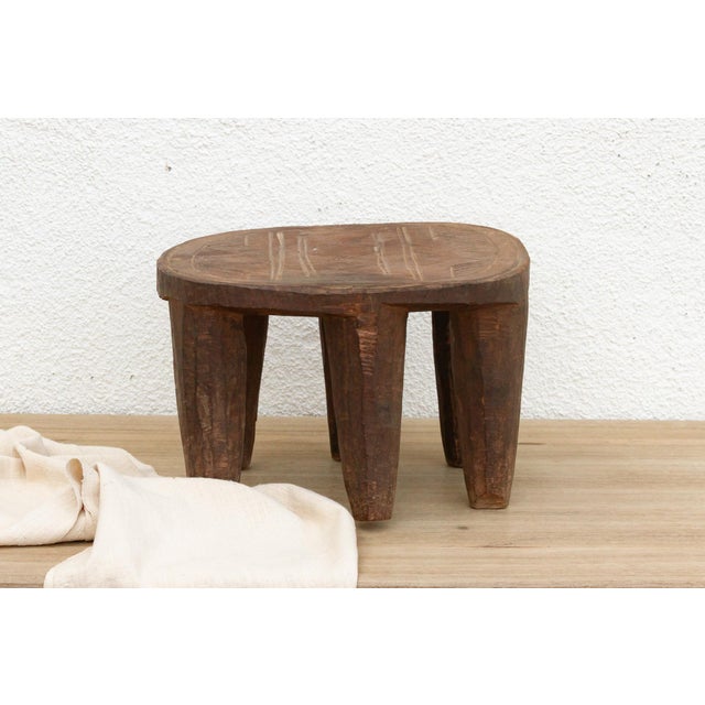 A unique piece of African art, this vintage Nupe table from Nigeria is a must-have for collectors and enthusiasts of Nupe...