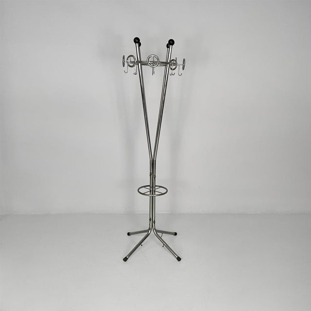 Italian mid-century modern plastic and metal coat rack, 1960s Metal coat rack. It has a chrome frame with four legs that...