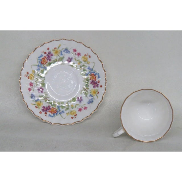 This lovely demitasse / tea cup and saucer set is made of bone china. This set is stamped as being made by Royal Doulton...