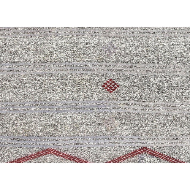This Vintage Turkish Rag Kilim, measuring 6'11" by 11', is handwoven in Western Turkey from recycled vintage fabrics...