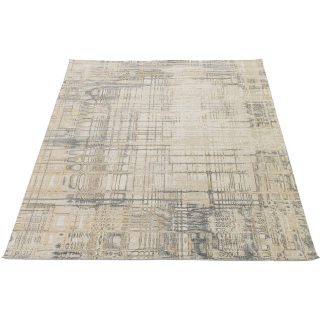 Elevate your space with this modern hand-loomed rug, featuring a deconstructed grid pattern that blends organic textures...
