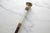 Victorian era wood walking stick cane with mother of pearl and brass detail. Handle is accented with a mother-of-pearl...