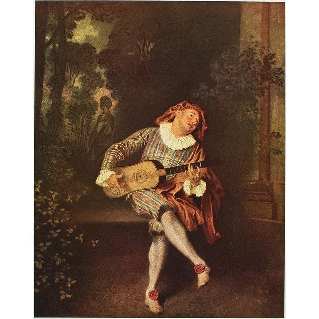 A beautiful reproduction print in full color of painting "Le Mezzetin" by Antoine Watteau. Comes from a vintage art...