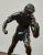 Bronze sculpture representing an athletic male figure in a dynamic stance, inspired by the ideals of classical ancient...