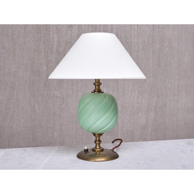 This very rare table lamp was designed by Bertil Brisborg and produced by Nordiska Kompaniet in Sweden in the late 1940s....