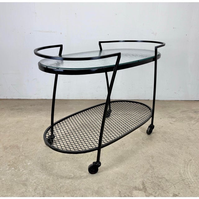 A fabulous sculptural outdoor bar car by Russell Woodard circa 1950’s. Features original “water pattern” glass top and...