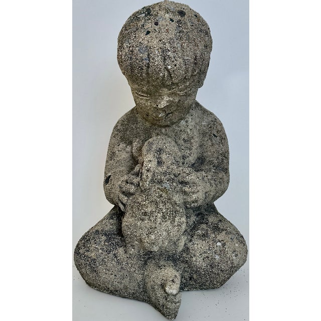 An endearing reconstituted stone garden ornament, this sweet boy cradling a bunny rabbit has all the quiet charm we love....