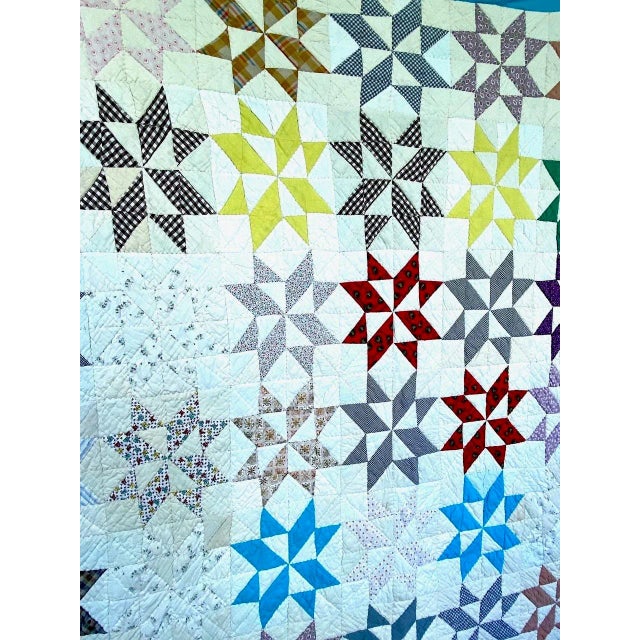 Wonderful vintage diamond-shaped patches in multiple colored cotton materials make up this mid-western eight point star...