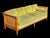 The Schoonbeck Co. Mid-Century French Louis XVI Style Walnut Caned Sofa with Loose Cushions and Bolster Pillows is a...