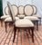 Elevate your dining room with this exceptional set of six Louis XVI- inspired medallion-back dining side chairs from...