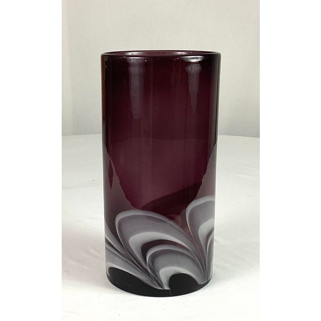 Large -Exotic-light purple-handblown vase q,with a white swirl design at the bottom that gives a flare to the vase Ground...