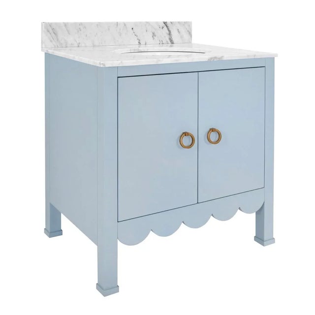 Sophistication with the Kealey light blue bath vanity in a crisp matte lacquer finish. Adorned with a delightful scallop...