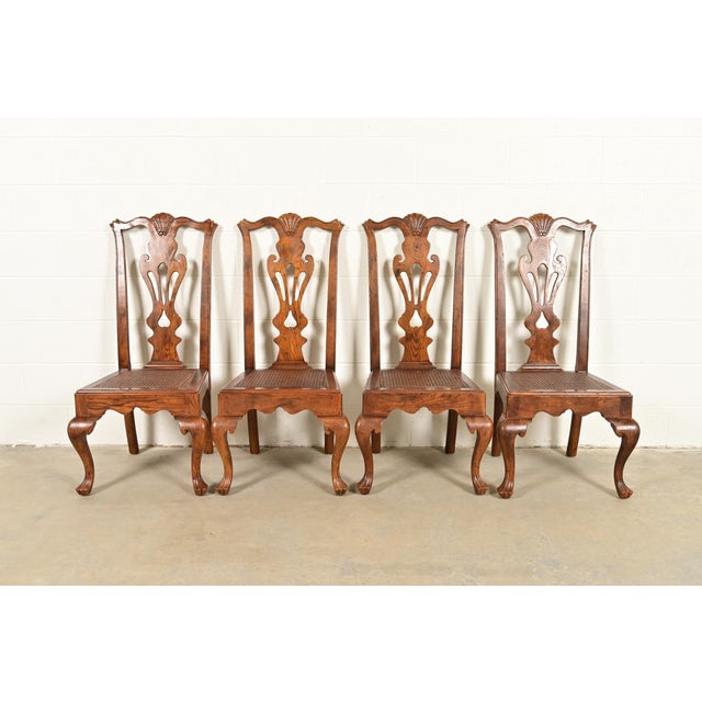 An outstanding set of four Chippendale or Georgian style side chairs or dining chairs By Henredon USA, Circa 1980s Carved...