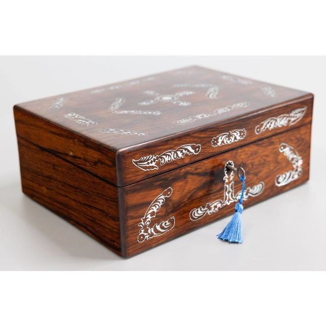 A superb antique Victorian English rosewood jewelry box with fitted interior, a removable inner jewelry tray, and fully...