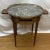 Circa 1940's Bouillotte Marble Top Table with pull out to leather glass holders and brass reticulated surround.