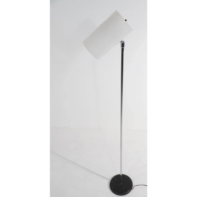 Classic post modern floor lamp by George Kovacs, circa 1970’s.T his version has a white plastic cylinder form shade, often...