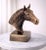 Add a bold statement of strength, elegance, and craftsmanship to your living space with this Antique Brass Finish Horse...