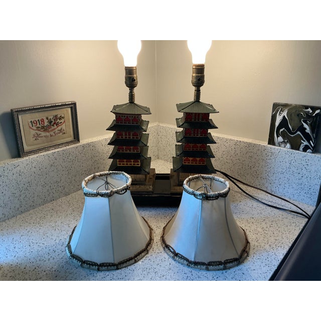 Fantastic 1940s Art Deco enameled metal lamps in the form of green and red pagodas. Also feature night light (see photo of...