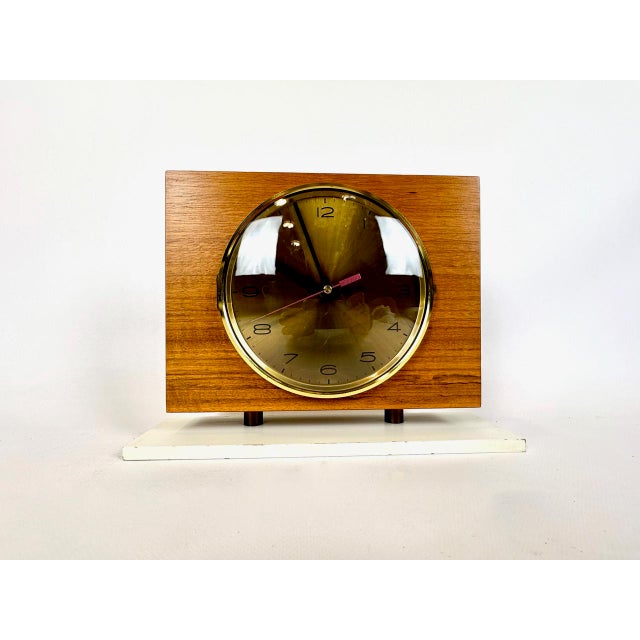 Mid-Century Modern Teak and Brass Table Clock from Emes, 1960s, in Flawless conditions. Designed 1960 to 1969 This piece...