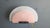 Glass wall sconce by Arteluce. The italian design wall lamp has a matte glass pink and white lamp shade and emit a soft...