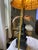 a vintage-style stacked elephant palm tree table lamp. This distinctive piece of home decor features a dark bronze or...