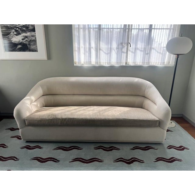The Huxley Sofa is inspired by 1970's lounge furniture. A curvaceous form with a single line tuft and long seat cushion...