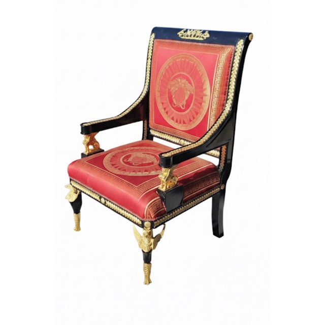 This elegant big empire armchair has a scrolled real wood frame with a Roman upholstery back and seat, the arms put down...