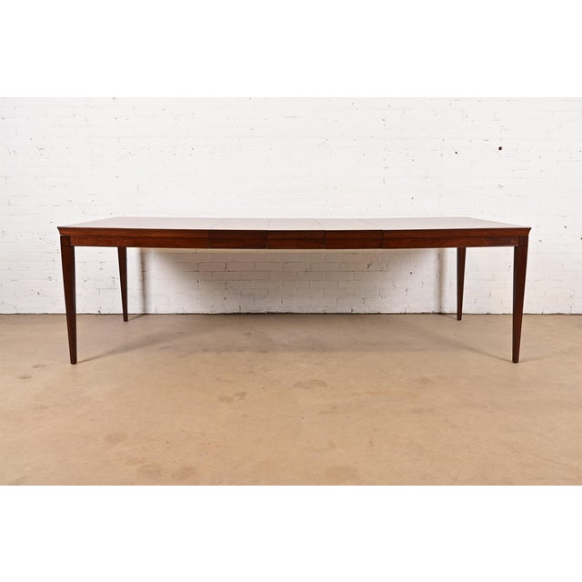 A gorgeous French Regency Louis XVI style carved mahogany extension dining table By Drexel USA, 1958 Measures: 62"W x 42"D...