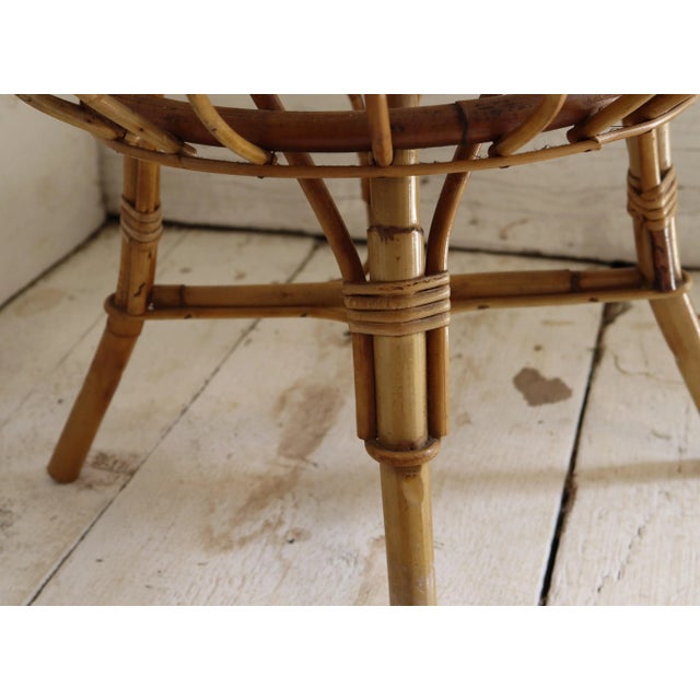 Iconic stool/coffee table, designed in the early 1960s by Franco Albini. It features concentric wicker weaves on a bamboo...