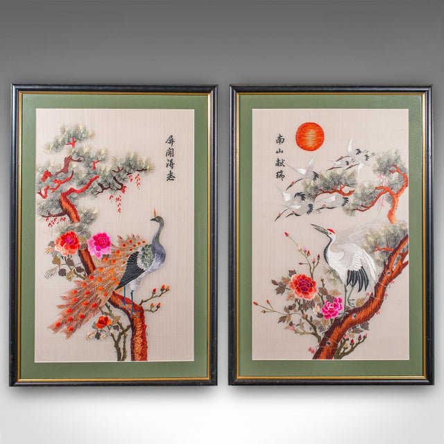 This is a tall pair of vintage bird embroideries. An Oriental, silk cotton wildlife scene, dating to the late 20th...