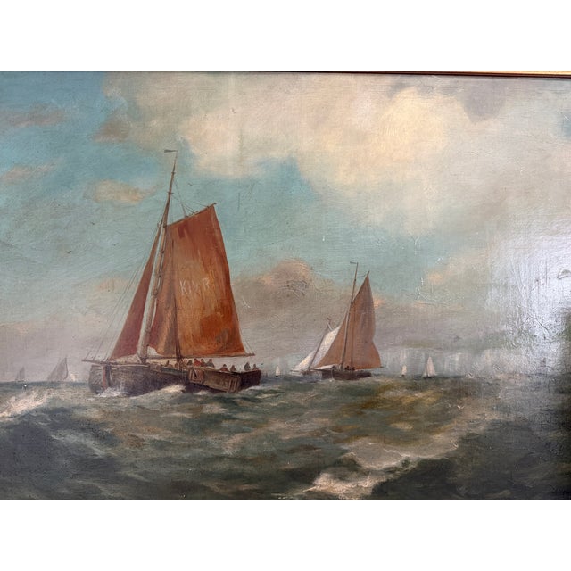 A compelling vintage oil painting on board depicting traditional sailing vessels navigating choppy coastal waters beneath...