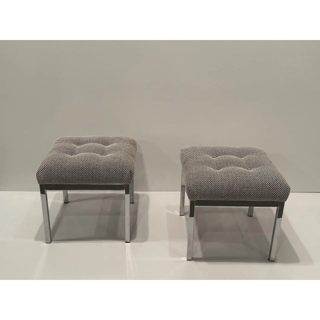 Versatile pair of square mid century modern chrome and upholstered ottomans stools having handsome new tufted tops.
