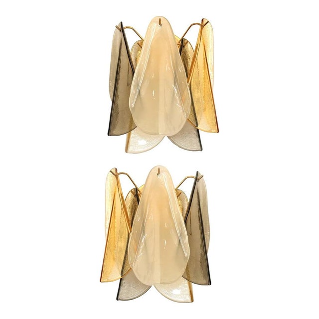 Scenographic and luxury murano glass wall sconces “rondini” elements in murano glass poured over a mold from a traditional...