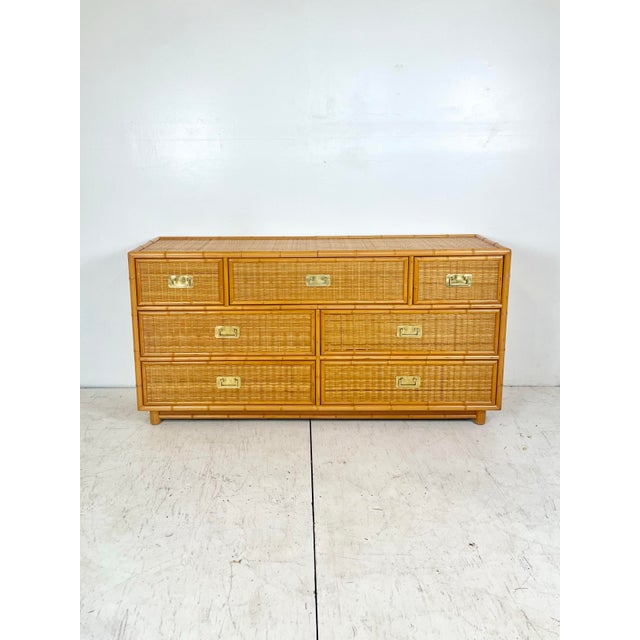 Vintage Dixie Furniture faux bamboo wicker chest of drawers. Long dresser with brass campaign hardware. Dovetail drawers....