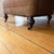 Pair of Chesterfield Tufted Deep Club Chairs With Turned Wooden Legs and Brass Casters For Sale - Image 13 of 16