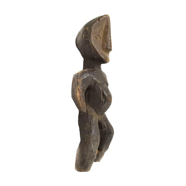 The Metoko people live on the left bank of the Zaire River in an area that is densely wooded. They are heavily influenced...
