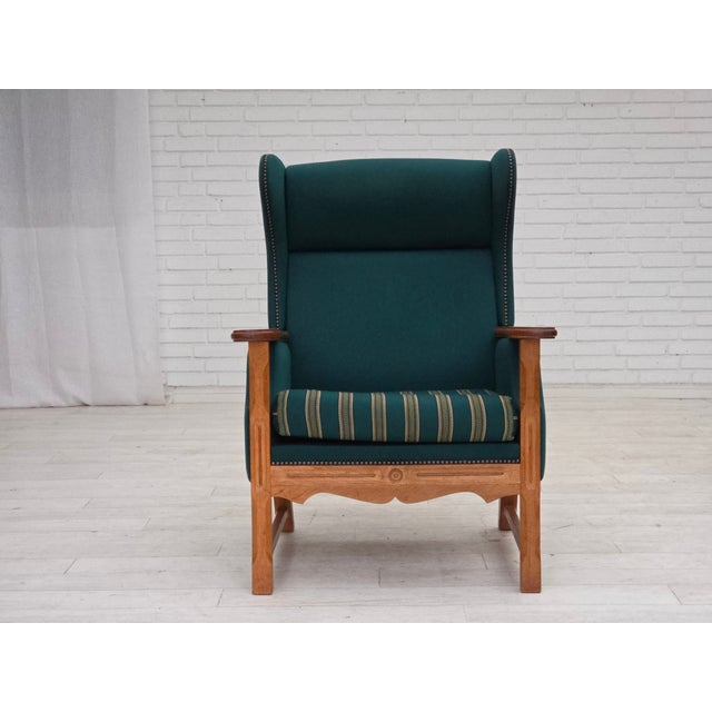 1970s, Danish high back armchair. Original turquoise green furniture wool, solid oak wood. Original good condition: no...