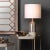 With an air of casual glamour, the Varnish Table Lamp elicits a two-toned finish. Dipped in a pewter taupe glaze from top...