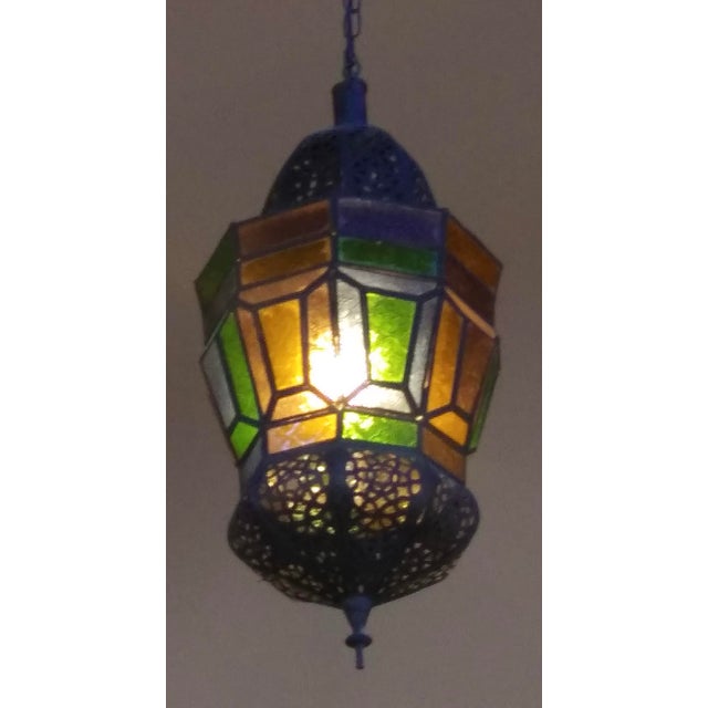 Handcrafted Moroccan pendant with multi-color molded glass and hand cut metal. Vintage mid 20th century Moroccan Hanging...