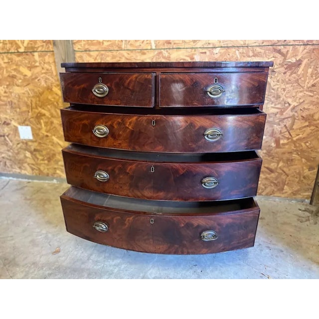 Antique Flame Mahogany Bow Front Chest of Drawers. Early 19th Century